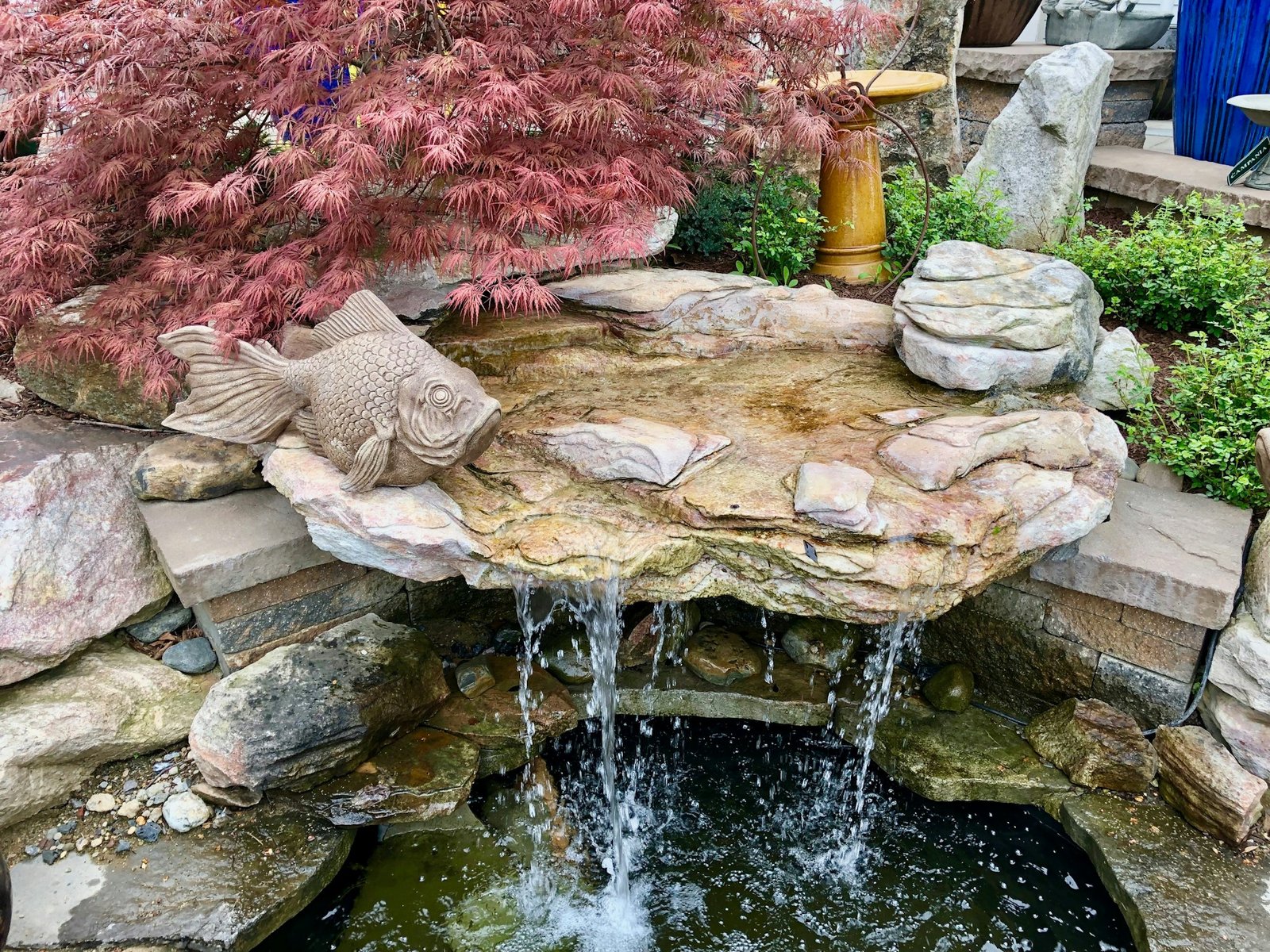 A beautiful, landscaped water feature provides a tranquil setting to relax.